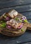 Sandwiches with grilled fish and quick pickled onions