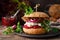 Sandwiches, hamburgers with homemade wholemeal bread, herring, puree of beetroot, red onion, parsley and fresh lettuce salad