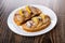 Sandwiches with mackerel, lemon in plate on dark table