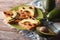 Sandwiches with peanut butter, raisins and ripe avocado close-up