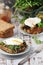 Sandwiches with pesto, poached eggs and green salad