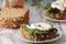 Sandwiches with pesto  poached eggs and green salad