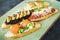 Sandwiches with prawn, salmon, mushroom on a plate. Restaurant food