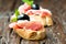 Sandwiches with prosciutto olive on wooden old table horizontal