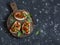 Sandwiches with quick ratatouille on rustic cutting board on a dark background. Delicious healthy vegetarian food.