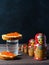 Sandwiches with red caviar of salmon fish. A glass of vodka, matryoshka. The concept of Russian tradition. Copy space. Vertical