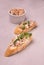 Sandwiches with rillettes, meat pate and fresh chives on gray vintage background. Composition with spread meat product.