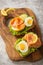 Sandwiches with smoked salmon, salad, cucumbers and eggs