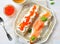 Sandwiches with soft cheese and smoked salmon caviar