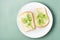 Sandwiches of white bread and fresh dill on a plate  on a green background. Vitamin Herbs in a healthy diet. Top view