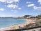 Sandy beach with bathers and parasols on a sunny day in Playa Blanca Lanzarote