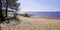 Sandy beach and blue water on Lake of Lacanau france