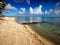 Sandy beach at the cyan sea. Maldives.