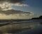 Sandy beach at dawn, sky and clouds