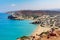 Sandy beach and lagoon with clear blue water at Crete island near Sitia town, Greece.