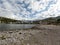 Sandy beach landscape of Meditteranean sea coast and mountain background in Port de Soller, Palma de Mallorca, Spain, Europe