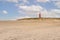 Sandy beach and lighthouse called