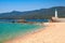 Sandy beach and lighthouse, Propriano, Corsica