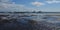 Sandy beach at low tide and ships