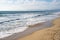 Sandy beach in Manhattan Beach California. Waves roll in