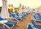 Sandy beach in the morning with sun beds, umbrellas, palm trees, Turkey, Side resort