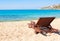 The sandy beach near the blue sea with sun beds. Mykonos