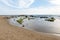 Sandy beach near Scala dei Turchi Stair of the Turks in Argigento, Sicily during the beautiful sunset with boulders and green