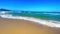 A sandy beach next to the ocean, tropical island beach, blue turquoise sea water
