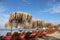 Sandy Beach With Palm Leaves Umbrella And Sunny