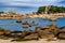 Sandy Beach And Pink Granit Boulders At The Atlantic Coast Of Ploumanach In Brittany, France