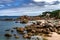 Sandy Beach And Pink Granit Boulders At The Atlantic Coast Of Ploumanach In Brittany, France