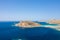 The sandy beach with pink reflections at the foot of the rocky cliffs, in Europe, Greece, Crete, Balos, By the Mediterranean Sea,