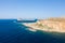 The sandy beach with pink reflections at the foot of the rocky cliffs, in Europe, Greece, Crete, Balos, By the Mediterranean Sea,