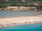 The sandy beach of Porto Giunco in Sardinia between the blue sea