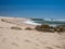 Sandy beach in Portugal, Povoa de Varzim, looking over sandstone rocks