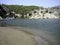 Sandy beach in quiet Sunny weather. Weak surf caressing the coastal sand