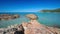 Sandy beach with red rocks in Corsica, France, Europe