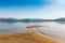 Sandy Beach on the River Amur. Khabarovsk region of the Russian Far East. Beautiful Bank of the Amur River snowy mountains and