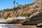 Sandy beach and  rocky cliffs. Shell Beach, California