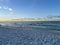 Sandy beach with serene ocean waves at dusk