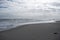 Sandy beach and waves, ocean shore