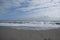 Sandy beach and waves, ocean shore