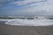 Sandy beach and waves, ocean shore
