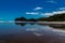 Sandy beaches,cliffs and rolling water on Bethels Beach. Auckland,New Zealand