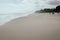 Sandy beachfront at Pikowai with patterns left in sand as water recedes