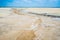 Sandy coastline of the salty lake Baskunchak. Lifeless hot terrain without vegetation and animals