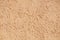 Sandy-colored modern grainy stucco texture