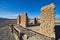 Sandy desert with abandoned and decayed stone structure