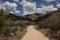 Sandy desert path to mountains