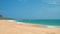 Sandy deserted paradise beach with palm trees on the ocean